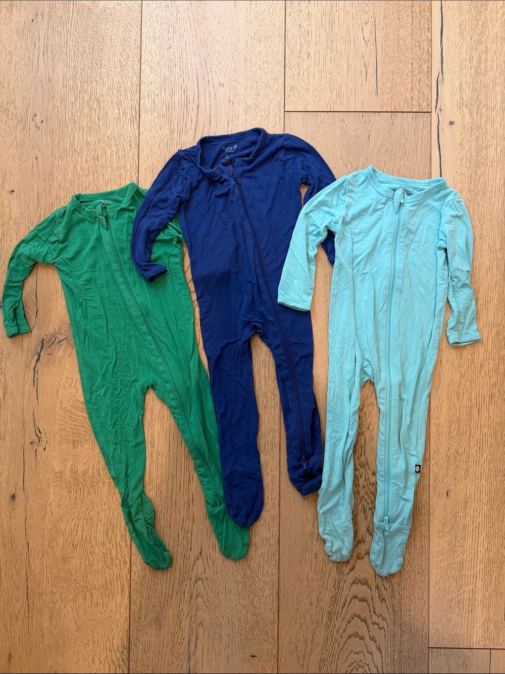 Kyte BABY 3-Pack Footed One-Pieces in Green, Navy & Light Blue